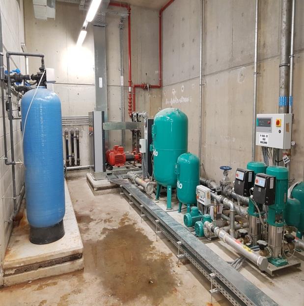 Booster pumping station with pressure vessels and water treatment