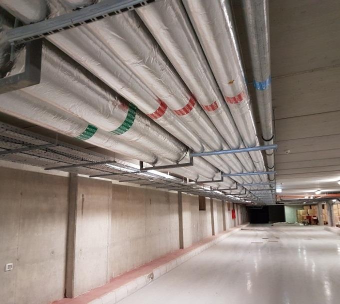 Insulated piping distribution across a basement level