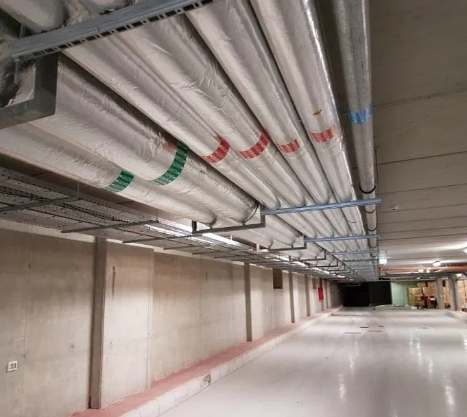 Insulated piping distribution across a basement level