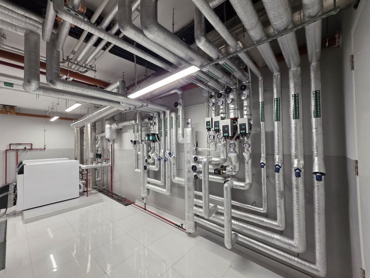 Villa Fawaz plant room — insulated piping manifolds, Rabieh
